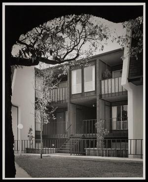 [Exterior of a home with multiple floors and large windows]