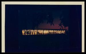 [Distant view of a library at night]