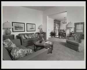 Primary view of object titled '[A living room with two couches and a chair]'.