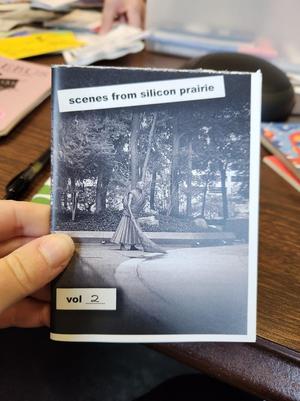 Primary view of object titled '[Morgan holding up a zine from Triangle Press, 2]'.