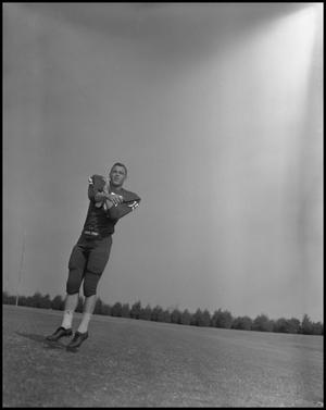 [Football Player Robert Duty Jumping, September 1960]