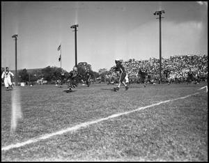 [A Play During a Football Game of Player Running, 1942]