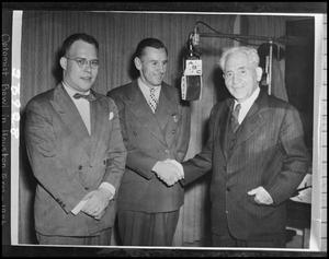 Primary view of object titled '[Three men in a radio studio]'.