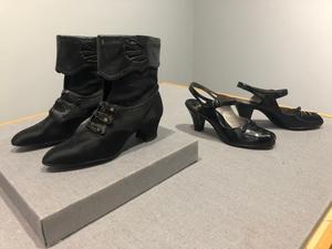 [Two black pair of shoes]