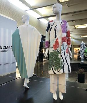 [Two ensembles on display for the "Fashion in Residence" exhibition]