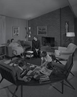 [A family and clergyman sitting in a home, 3]
