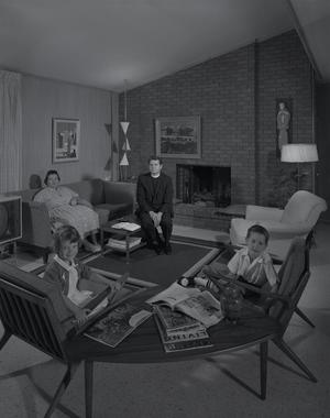[A family and clergyman sitting in a home, 4]