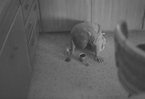 [A boy on the floor with a cup, 3]