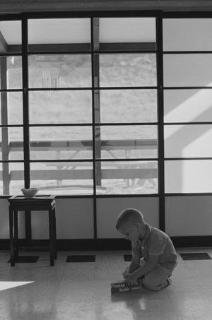 [A boy playing in a Japanese-inspired cabin, 3]