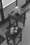 Photograph: [Two small tables in a cabin's living room, 3]