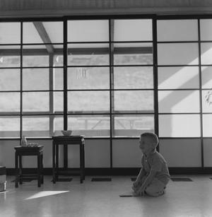 [A boy playing in a Japanese-inspired cabin, 5]