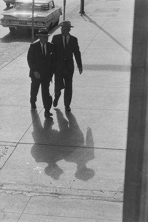 [Two men walking away from a car, 1]
