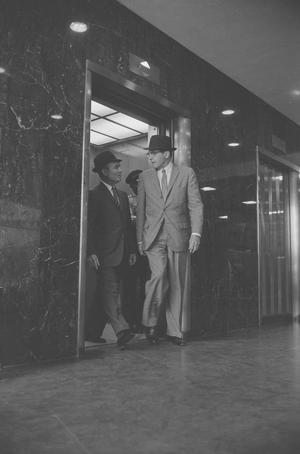 [Two men leaving an elevator in Dallas, 3]
