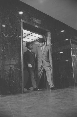 [Two men leaving an elevator in Dallas, 6]