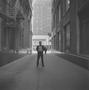 Photograph: [A suited man on a dark street]
