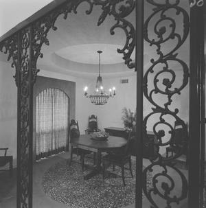 [A filigree archway before a dining area, 2]