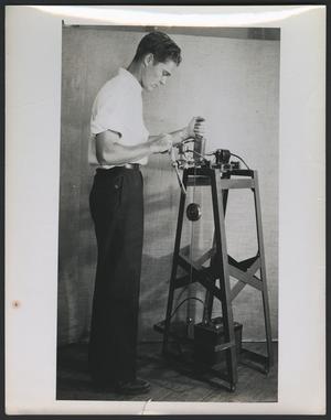 [Unidentified man working on a propeller blade, 3]