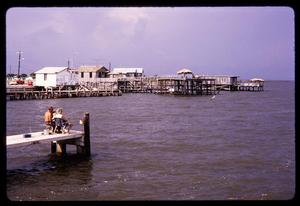 [Water front buildings with fishermen]