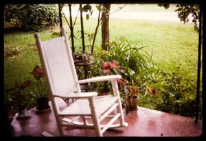 [White rocking chair on porch, 2]
