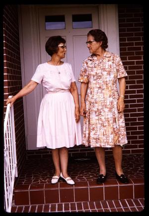 Primary view of object titled '[Two people standing on a porch, 2]]'.