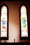 Photograph: [Two tall stained glass windows]