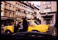 Photograph: [Adult in a bright yellow car]