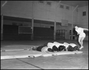 [Women's gymnastics student tumbling, 1942]