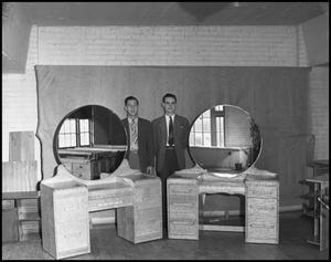 [Two Men Standing With Handmade Vanity Desks]