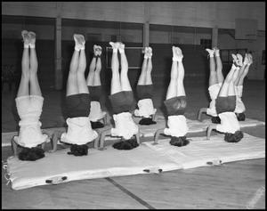 [Women's Gymnastics students practicing head stands, 1942]