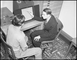 [Library Director Dr. Hoole with student in 1942]