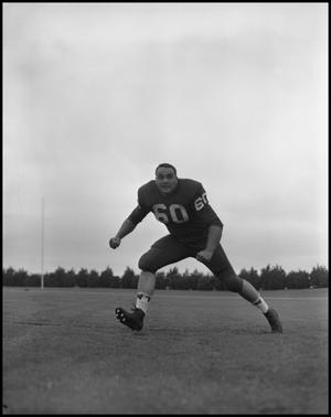 [Football Player No. 60 Running on the Field, September 1962]