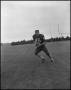 Photograph: [Football Player No. 45 Running with a Football, September 1962]