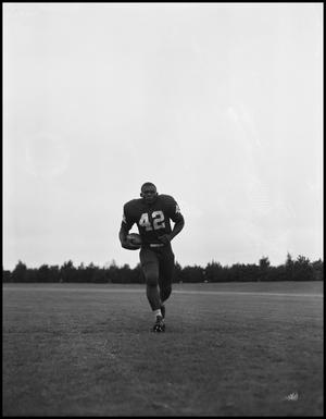[Football Player No. 42 Running with a Football, September 1962]
