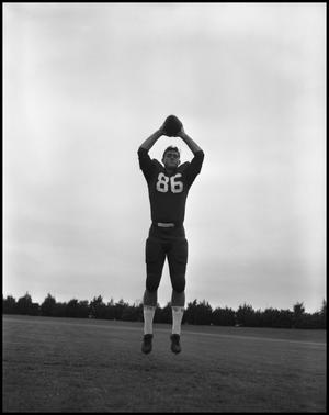 [Football Player No. 86 Catching a Football, September 1962]