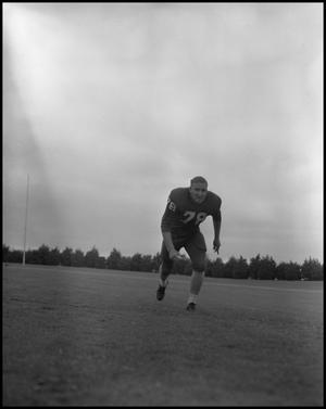 [Football Player No. 78 Running on the Field, September 1962]