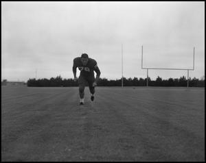 Football Player No. 79 Running in a Low Position, September 1962]