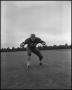 Photograph: [Football Player No. 54 in a Blocking Position, September 1962]