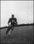 Photograph: [Football Player No. 35 Running with a Ball, September 1962]