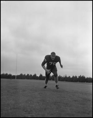 [Football Player No. 78 Running Low on the Field, September 1962]