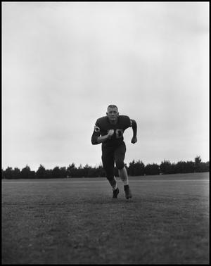 Football Player No. 70 Running on the Field, September 1962]