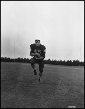 [Football Player No. 45 Clutching the Ball to Himself, September 1962]