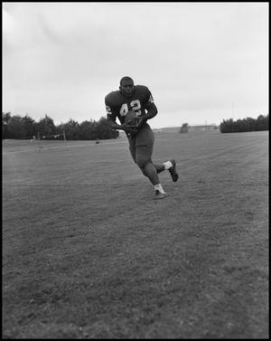 [Football Player No. 42 Running with the Ball, September 1962]