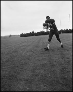 [Football Player No. 84 Catching a Football, September 1962]