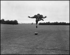 [Football Player No. 64 in Midair, September 1962]