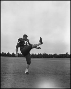 [Football Player No. 72 in a Kicking Position, September, 1962]