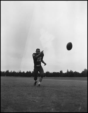 [Football Player No. 16 Running towards the Football Flying through the Air, September 1962]