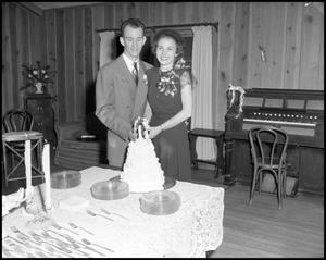 [Couple with Wedding Cake]