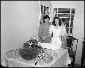 [Bride and Groom with Wedding Cake]