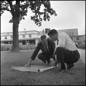 [Dr. Farmer and Dr. Spurlock Reviewing Building Plans for the New Student Union]