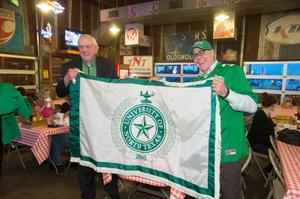 [Photograph of UNT Presidents with flag]